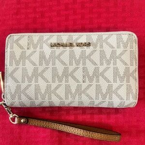Michael Kors Monogrammed cream wristlet/wallet